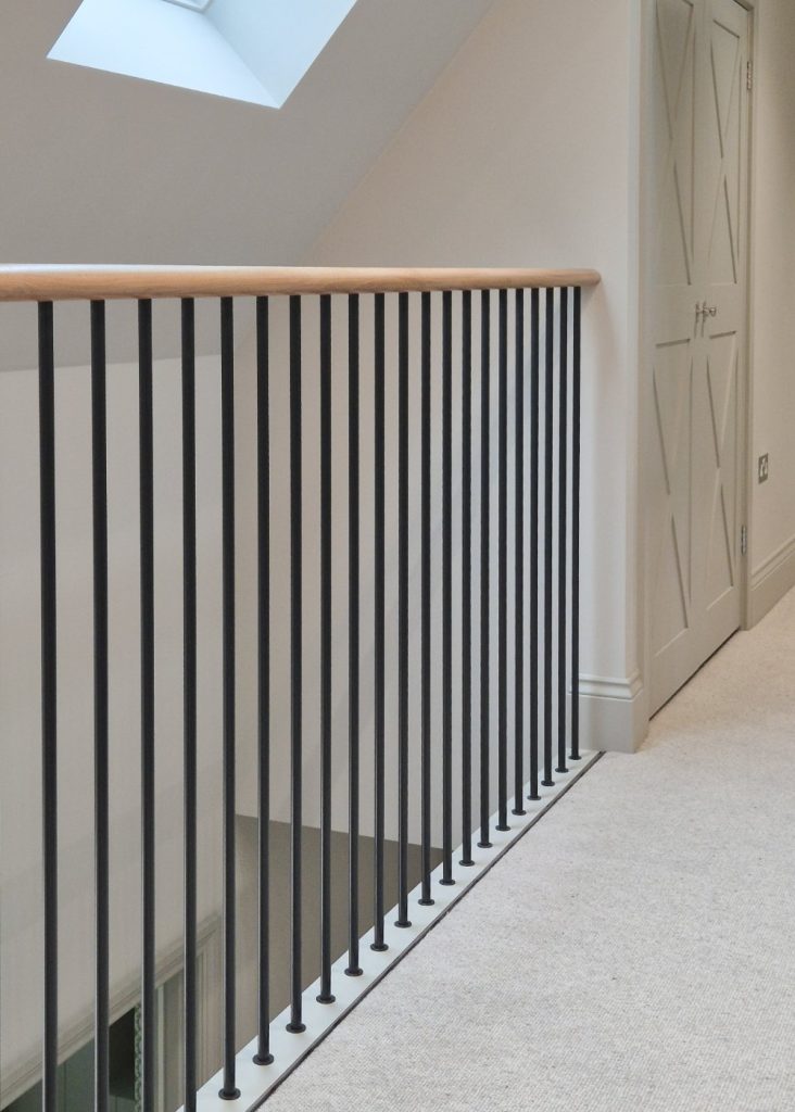 Understanding Your Wooden Handrail Clear lacquered handrail on a straight landing balustrade