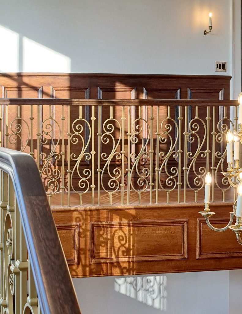 Understanding Your Wooden Handrail Dark-stained handrail on a gallery landing