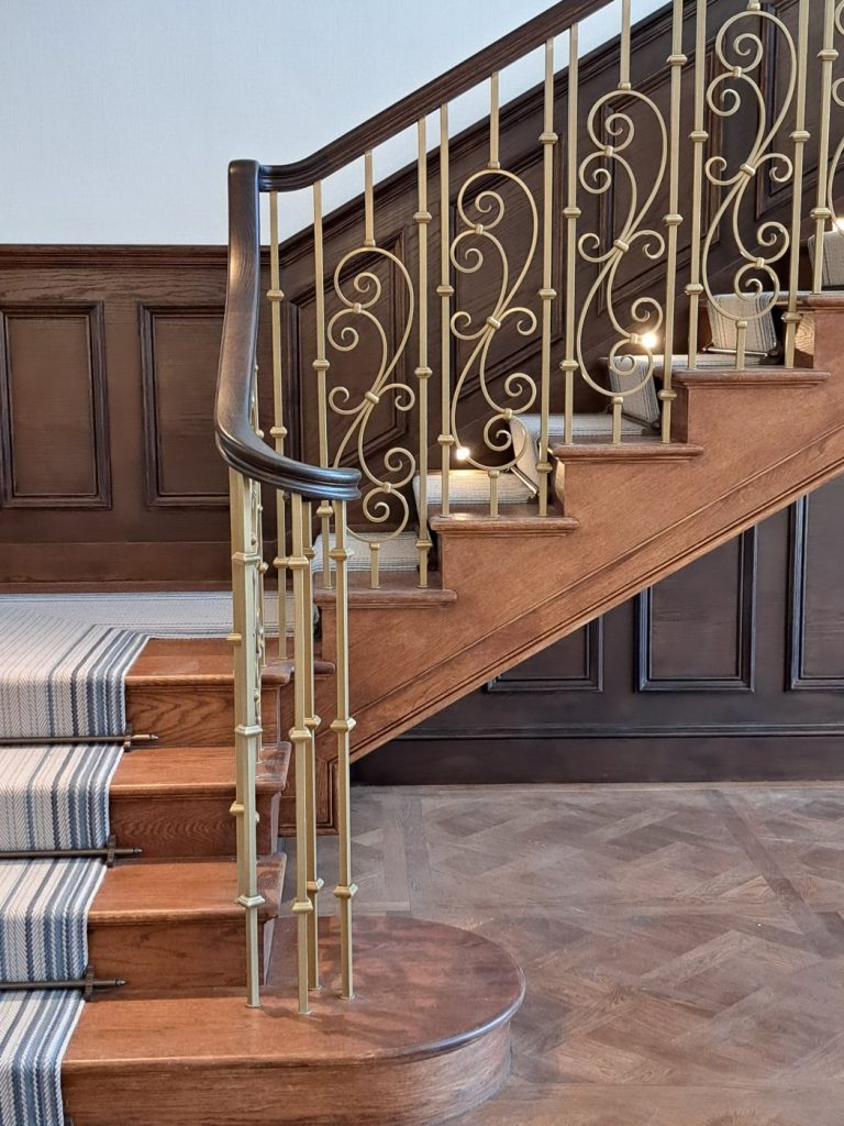 Understanding Your Wooden Handrail Dark-stained handrail volute and first flight